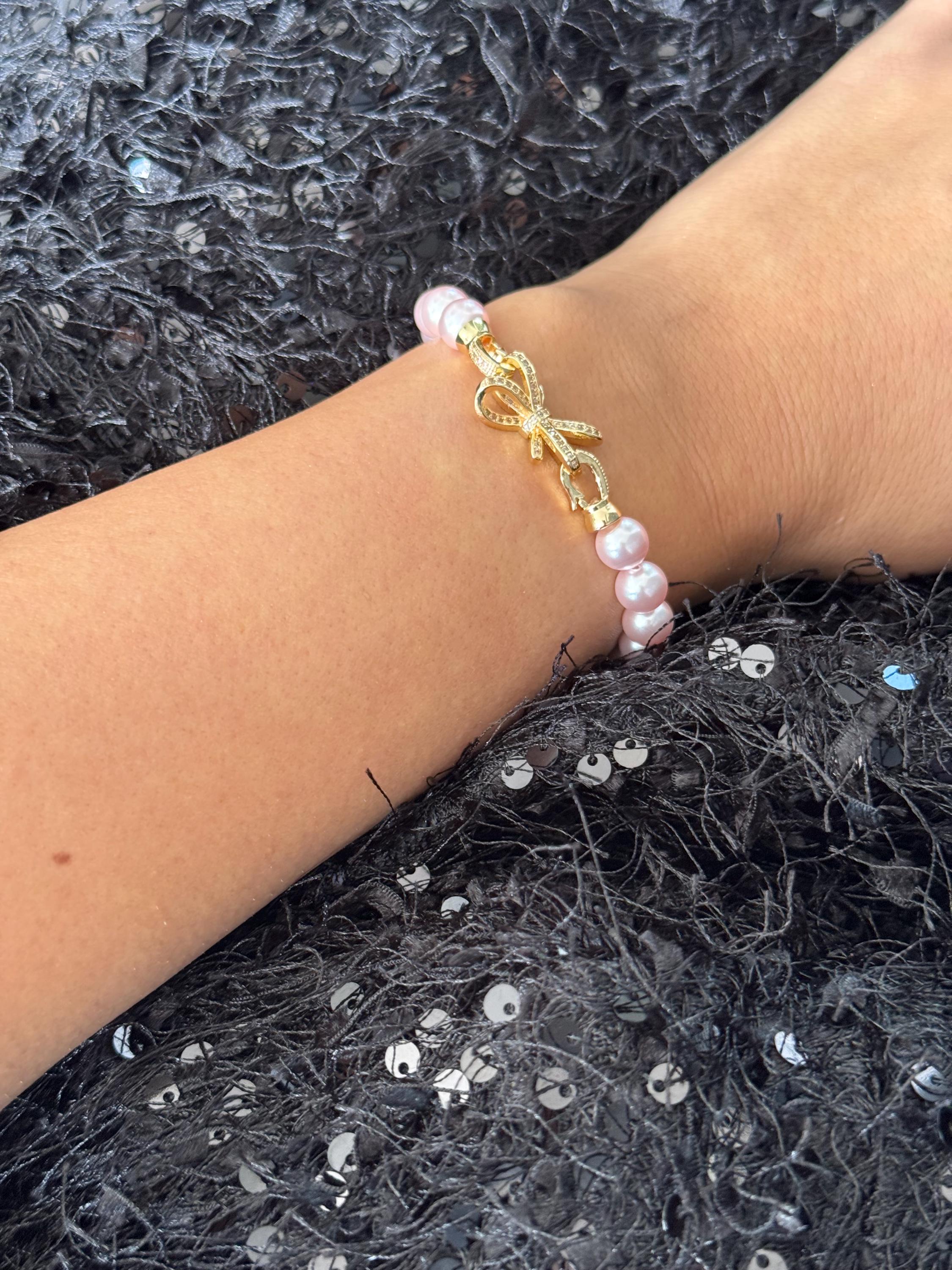 Pink Pearl Bracelet Wedding Day Accessory Bridesmaid Bow Jewelry Elegant Crystal Design Adjustable Length Option Dainty Feminine Style Special Occasion Gift Perfect Bridal Party Present Rhinestone Clasp Detail Rose Gold Plating Customizable
