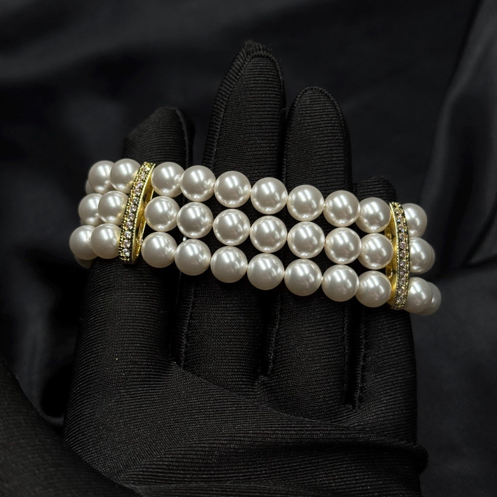 Handmade pearl bracelet with three rows of luminous 8mm pearls and elegant gold or platinum spacers, luxury wedding or anniversary jewelry