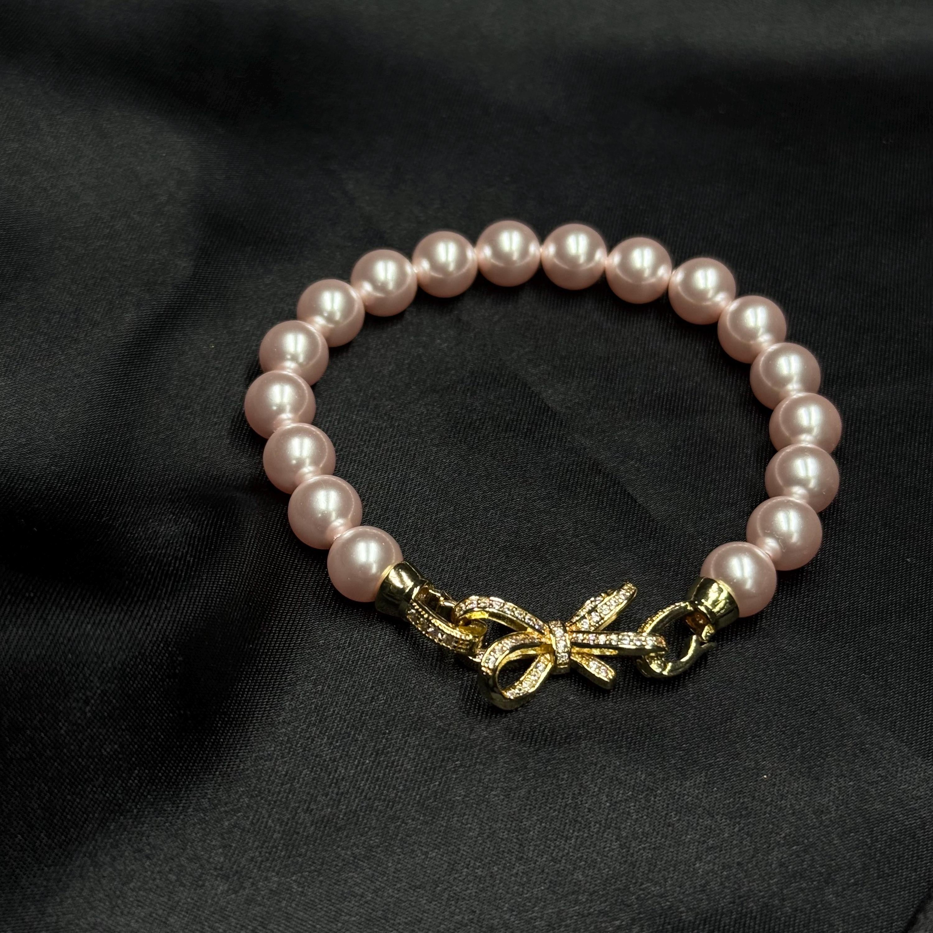 Birthday Gift Jewelry Pink Pearl Bracelet Special Occasion Accessory Bow Charm Design Elegant Feminine Style Perfect Present Idea Customizable Length Option Crystal Pearl Quality Rhinestone Clasp Detail Adjustable Size Bracelet Beautiful