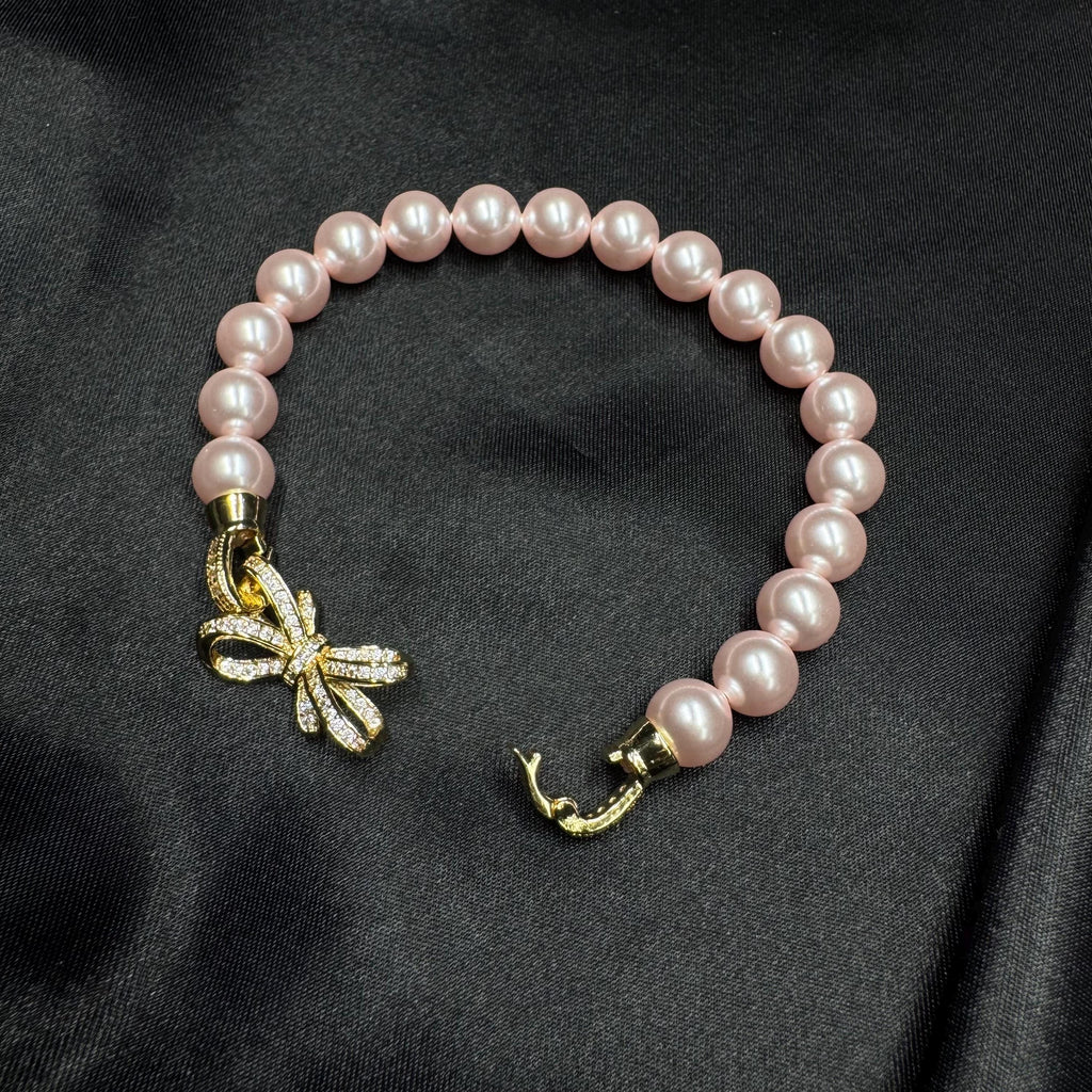 Birthday Gift Jewelry Pink Pearl Bracelet Special Occasion Accessory Bow Charm Design Elegant Feminine Style Perfect Present Idea Customizable Length Option Crystal Pearl Quality Rhinestone Clasp Detail Adjustable Size Bracelet Beautiful