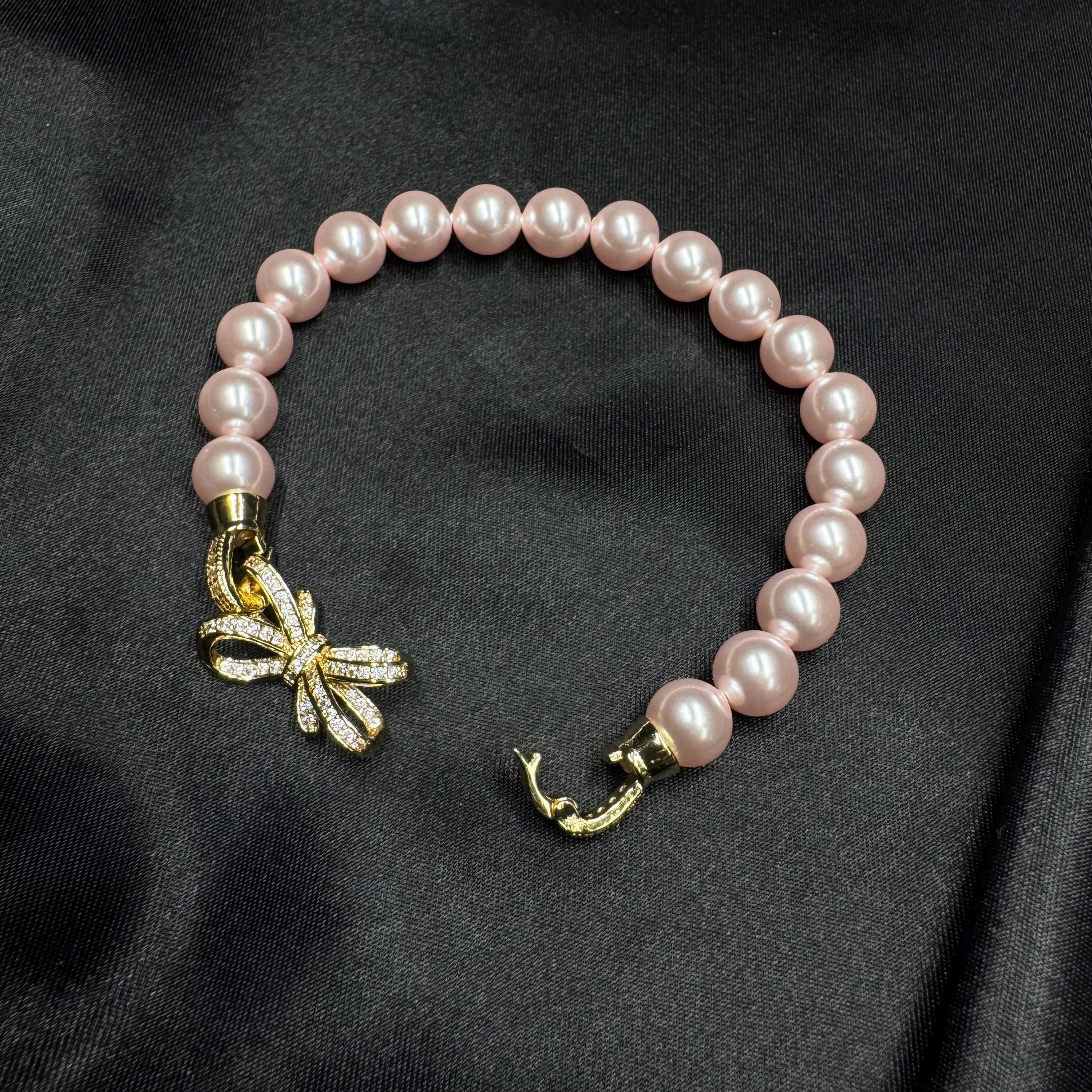 Birthday Gift Jewelry Pink Pearl Bracelet Special Occasion Accessory Bow Charm Design Elegant Feminine Style Perfect Present Idea Customizable Length Option Crystal Pearl Quality Rhinestone Clasp Detail Adjustable Size Bracelet Beautiful