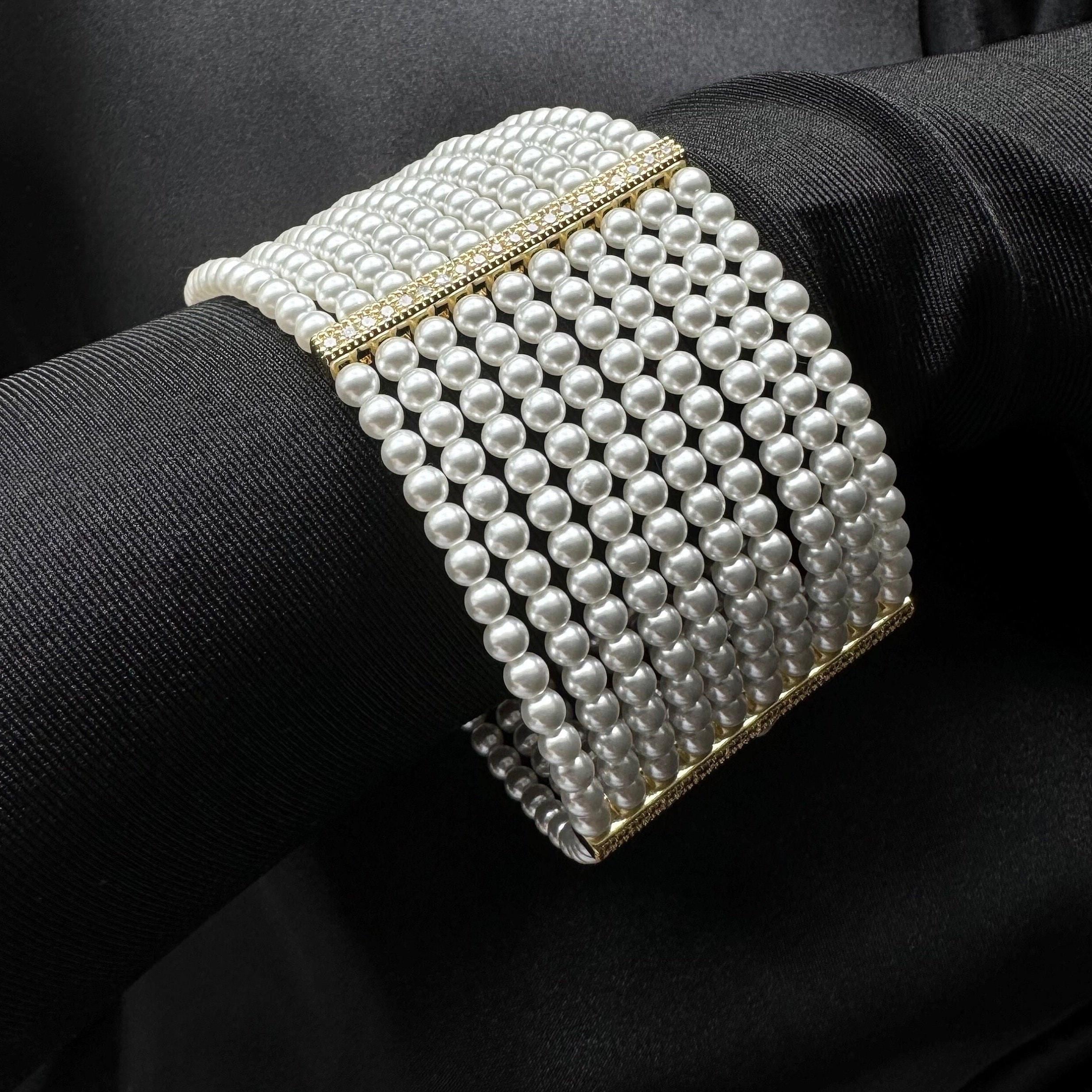 Pearl Bridal Bracelet Wedding Jewelry Statement Piece Elegant Accessory Ten Strand Design Rhinestone Detail Gold Silver Options Luxurious Layered Look Perfect Wedding Day Jewelry Sophisticated Wrist Adornment Formal Occasion Wear Beautiful