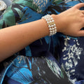 Handmade pearl bracelet with three rows of luminous 8mm pearls and elegant gold or platinum spacers, luxury wedding or anniversary jewelry