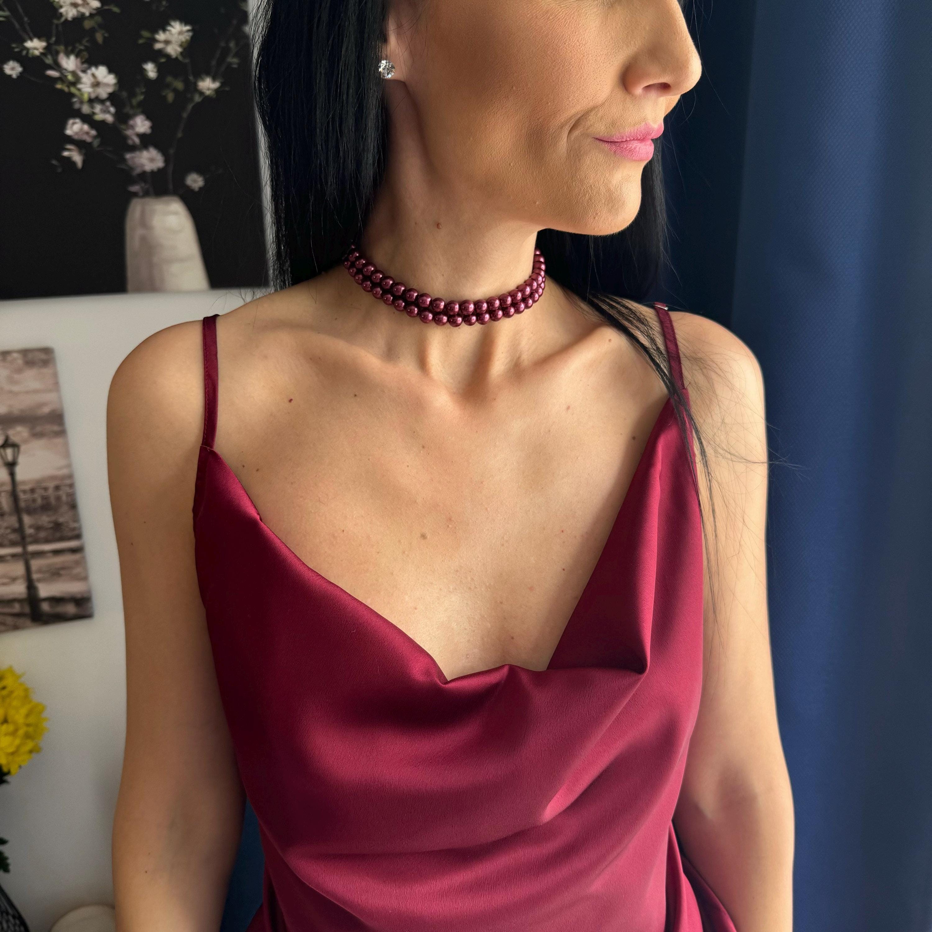 Burgundy Pearl Necklace Elegant Formal Accessory Two Strand Design Statement Piece Evening Wear Collection Wine Red Beads Classic Style Sophisticated Jewelry Gold Clasp Detail Special Occasion Essential Dressy Event Accessory Timeless