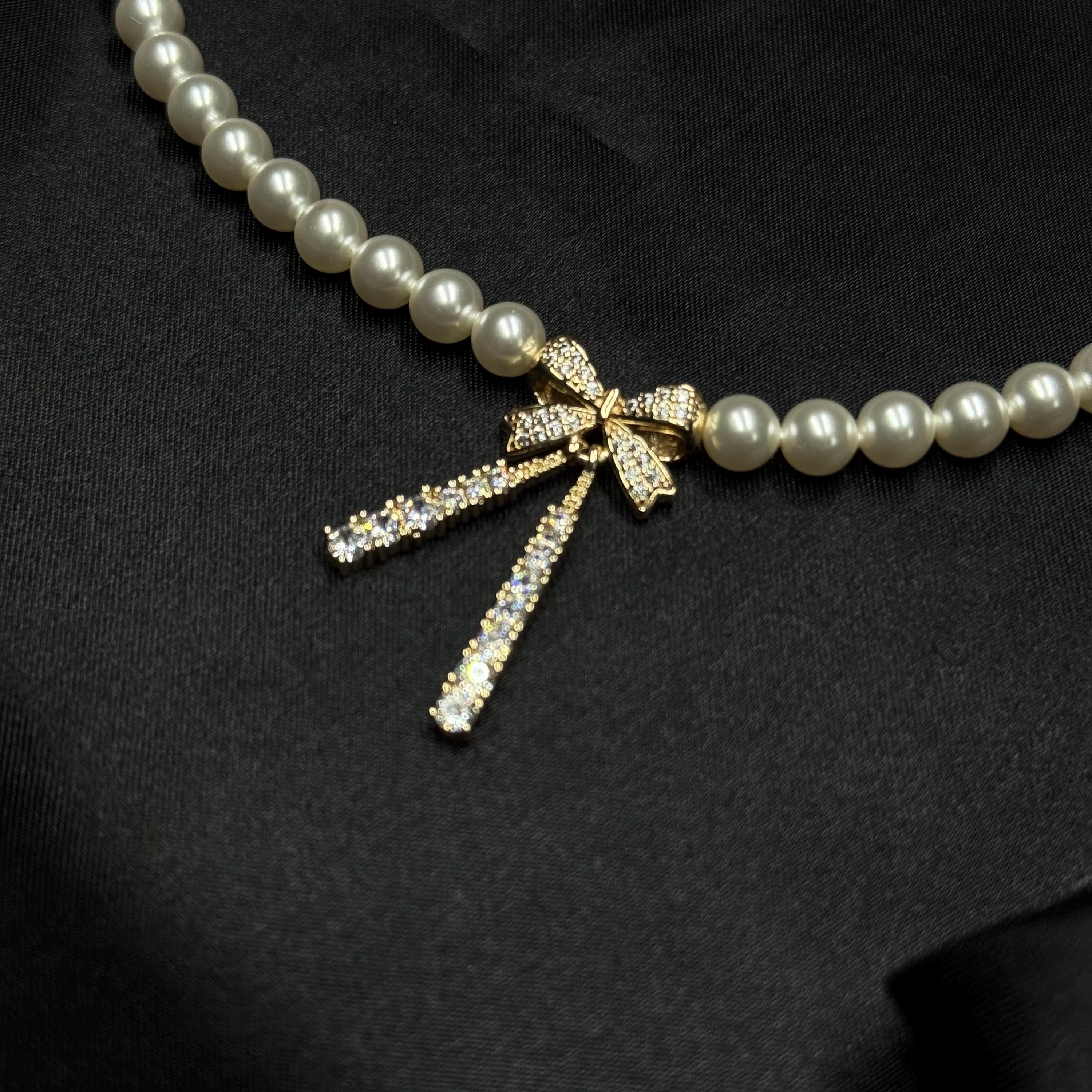 Dainty Bow Necklace Pearl Crystal Design Elegant Choker Style Adjustable Length Chain Gold Silver Options Premium Quality Materials Sophisticated Neck Piece Formal Event Jewelry Special Occasion Accessory Perfect Gift Idea Women Feminine