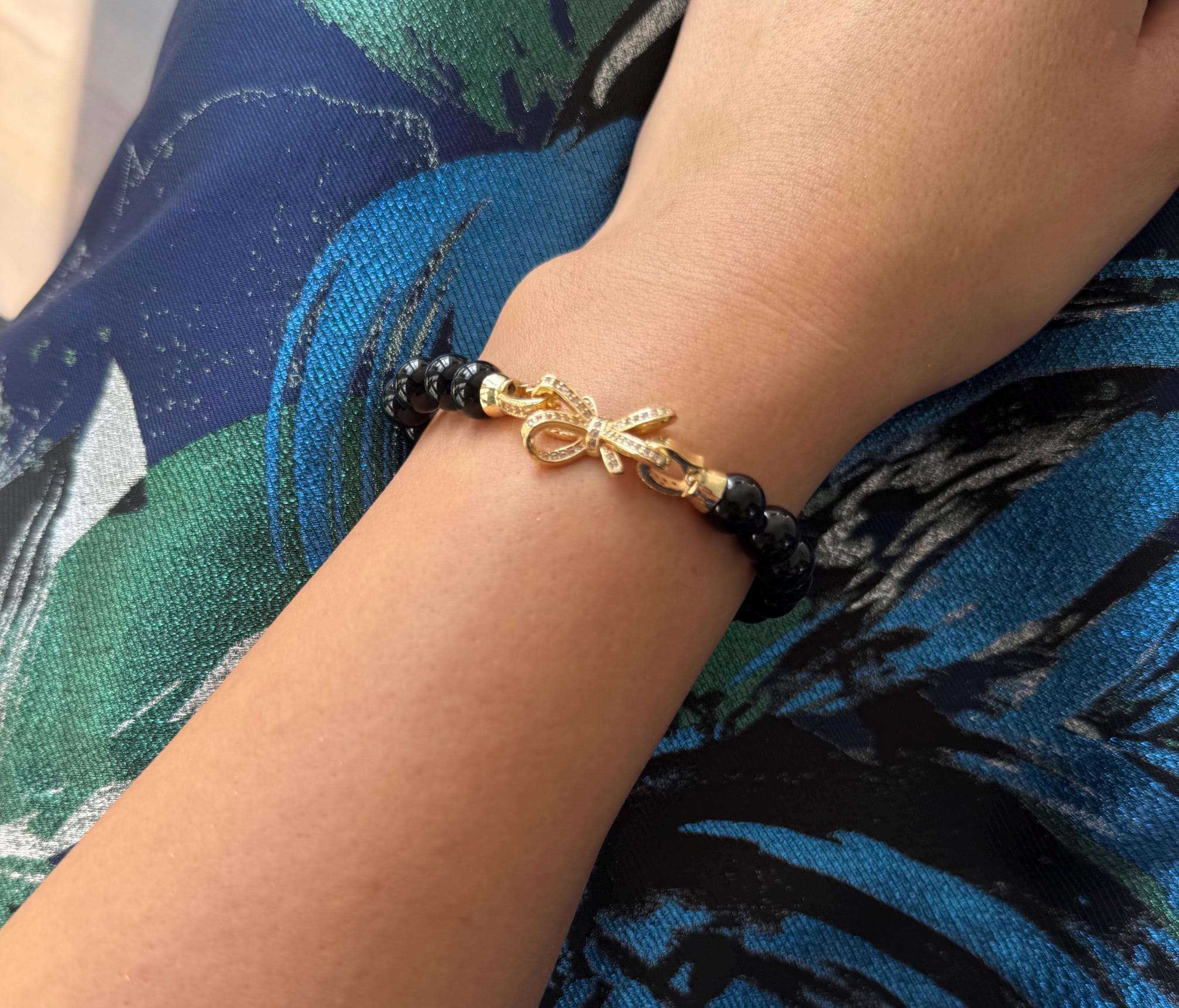 Gold Charm Bracelet Black Pearl Design Crystal Detail Work Elegant Evening Wear Sophisticated Style Statement Jewelry Piece Fashion Forward Accessory Luxury Gift Option Special Occasion Jewelry Timeless Beauty Versatile Wearable Art Dressy