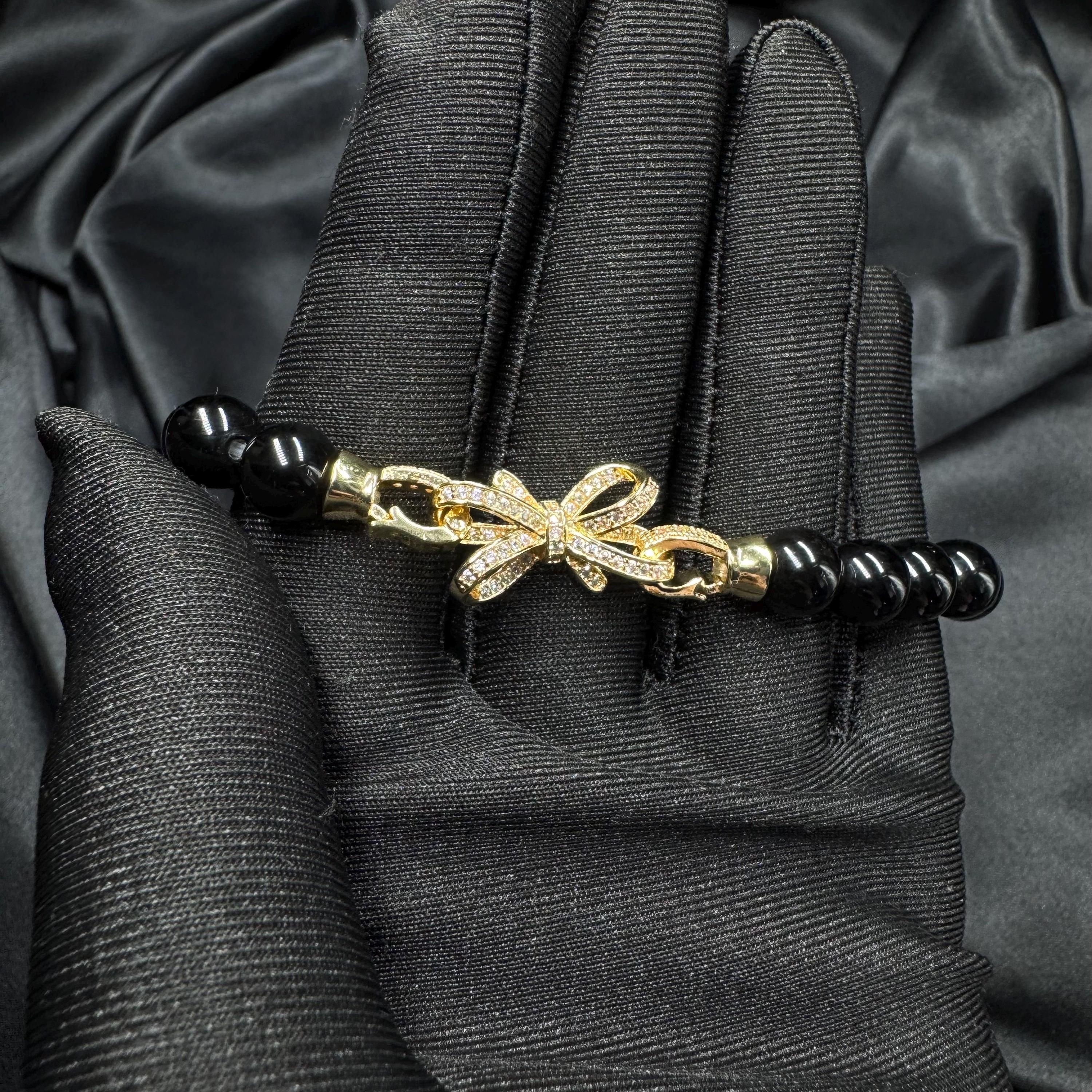 Statement Jewelry Piece Black Pearl Bracelet Gold Charm Accent Crystal Detail Work Elegant Design Element Sophisticated Style Fashion Forward Creation Luxury Gift Option Special Occasion Essential Perfect Present Idea Timeless Beauty