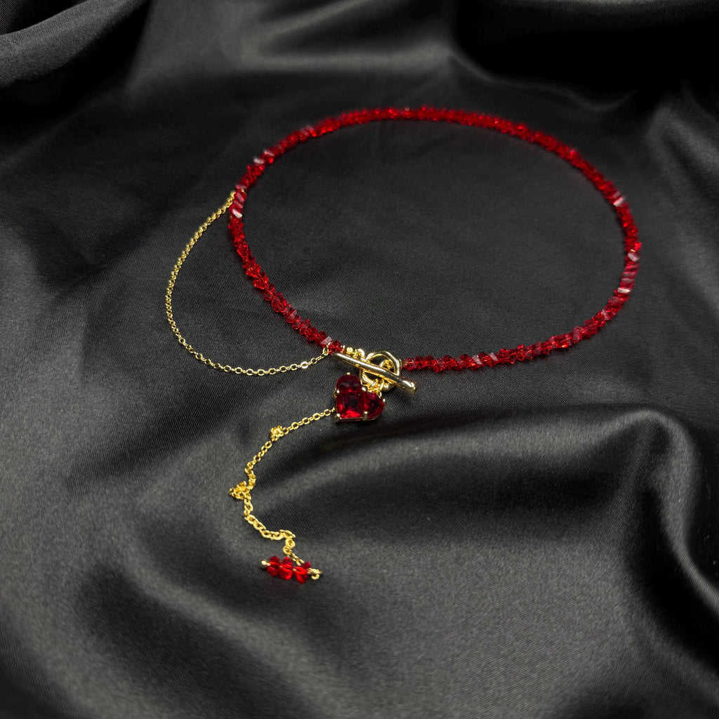 Fashion Forward Accessory Red Beaded Choker Necklace Gold Toggle Design Heart Charm Detail Statement Jewelry Piece Elegant Women Collection Modern Style Trend Premium Quality Construction Valentine Gift Idea Special Occasion Wear