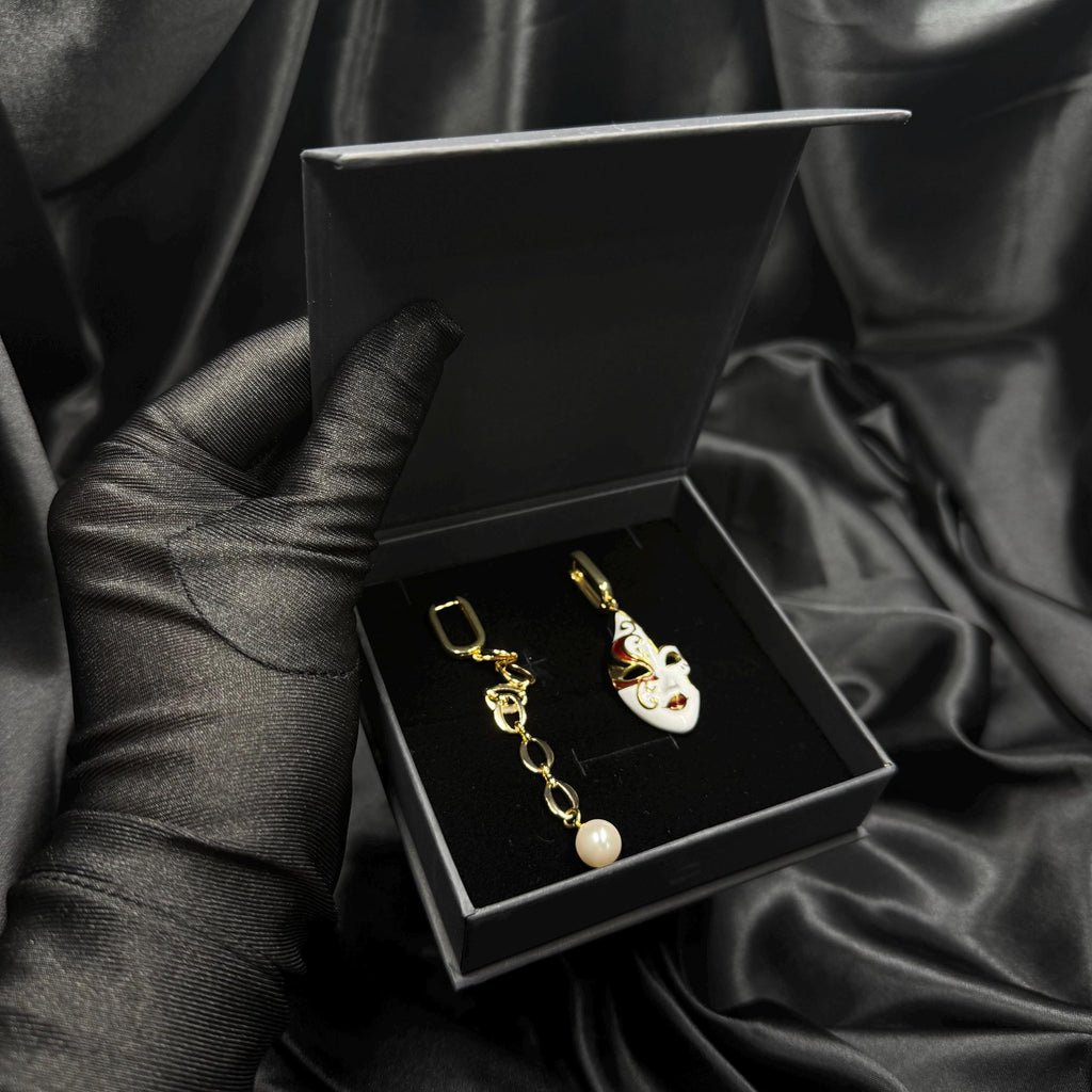 Luxury Pearl Earrings Gold Hoop Design Venetian Mask Charm Asymmetrical Style Statement Jewelry Handmade Creation Unique Gift Idea Mismatched Earring Pair Crystal Detail White Gold Accents Carnival Accessory Evening Wear Formal Events