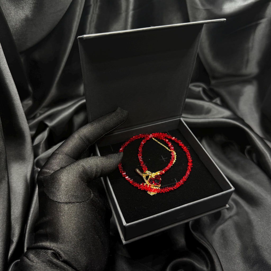 Fashion Forward Accessory Red Beaded Choker Necklace Gold Toggle Design Heart Charm Detail Statement Jewelry Piece Elegant Women Collection Modern Style Trend Premium Quality Construction Valentine Gift Idea Special Occasion Wear