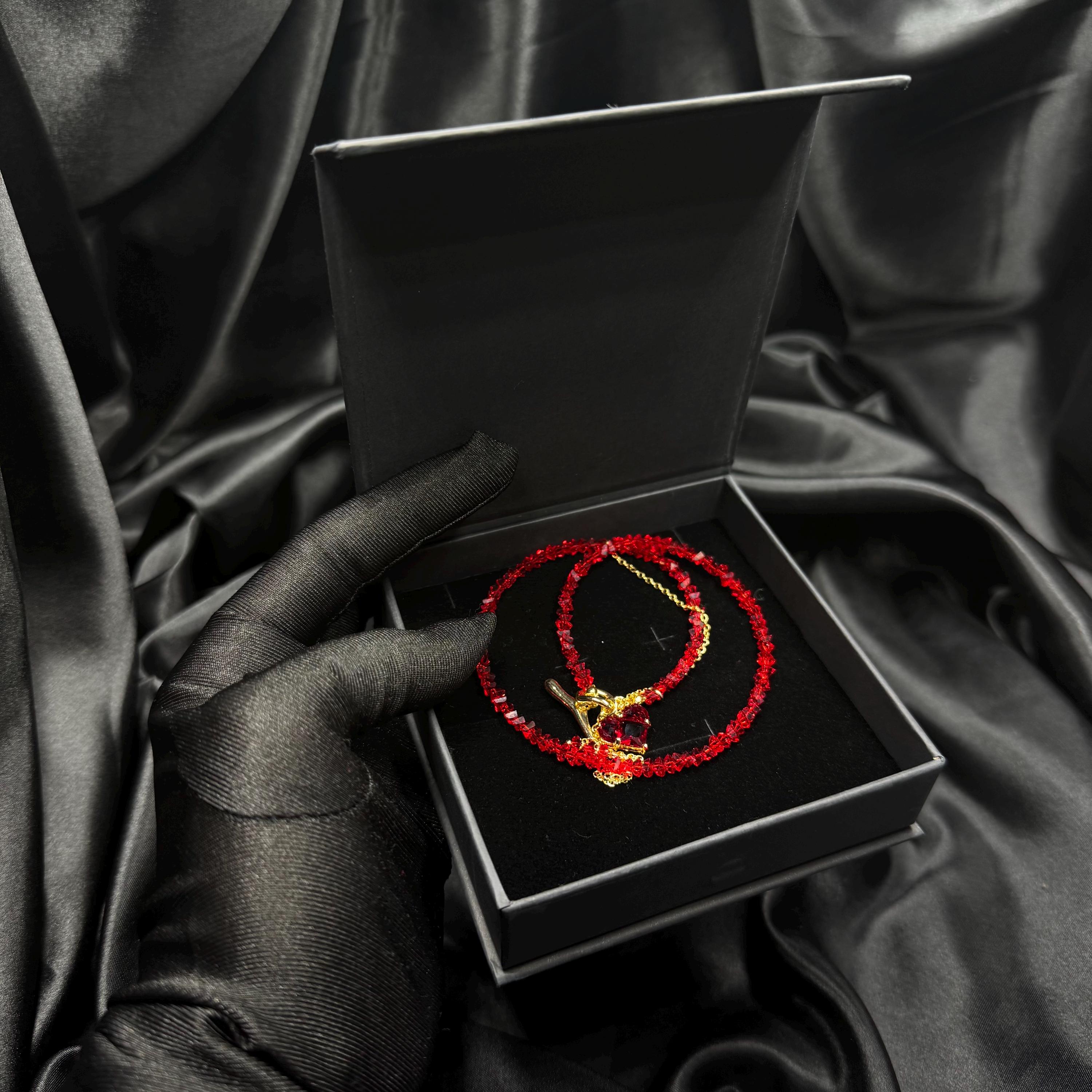 Fashion Forward Accessory Red Beaded Choker Necklace Gold Toggle Design Heart Charm Detail Statement Jewelry Piece Elegant Women Collection Modern Style Trend Premium Quality Construction Valentine Gift Idea Special Occasion Wear