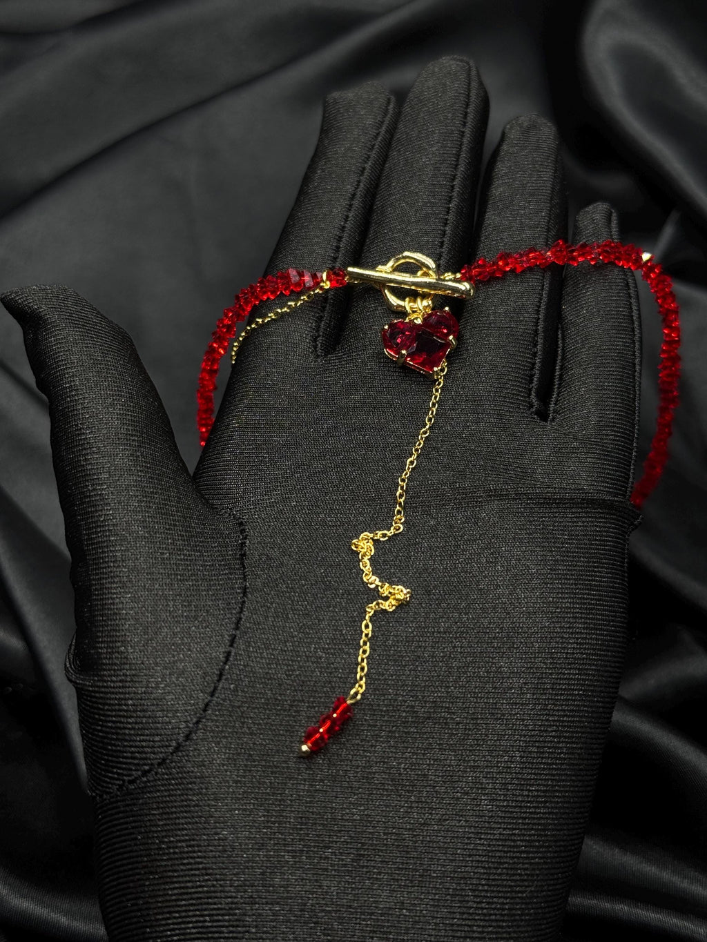 Fashion Forward Accessory Red Beaded Choker Necklace Gold Toggle Design Heart Charm Detail Statement Jewelry Piece Elegant Women Collection Modern Style Trend Premium Quality Construction Valentine Gift Idea Special Occasion Wear