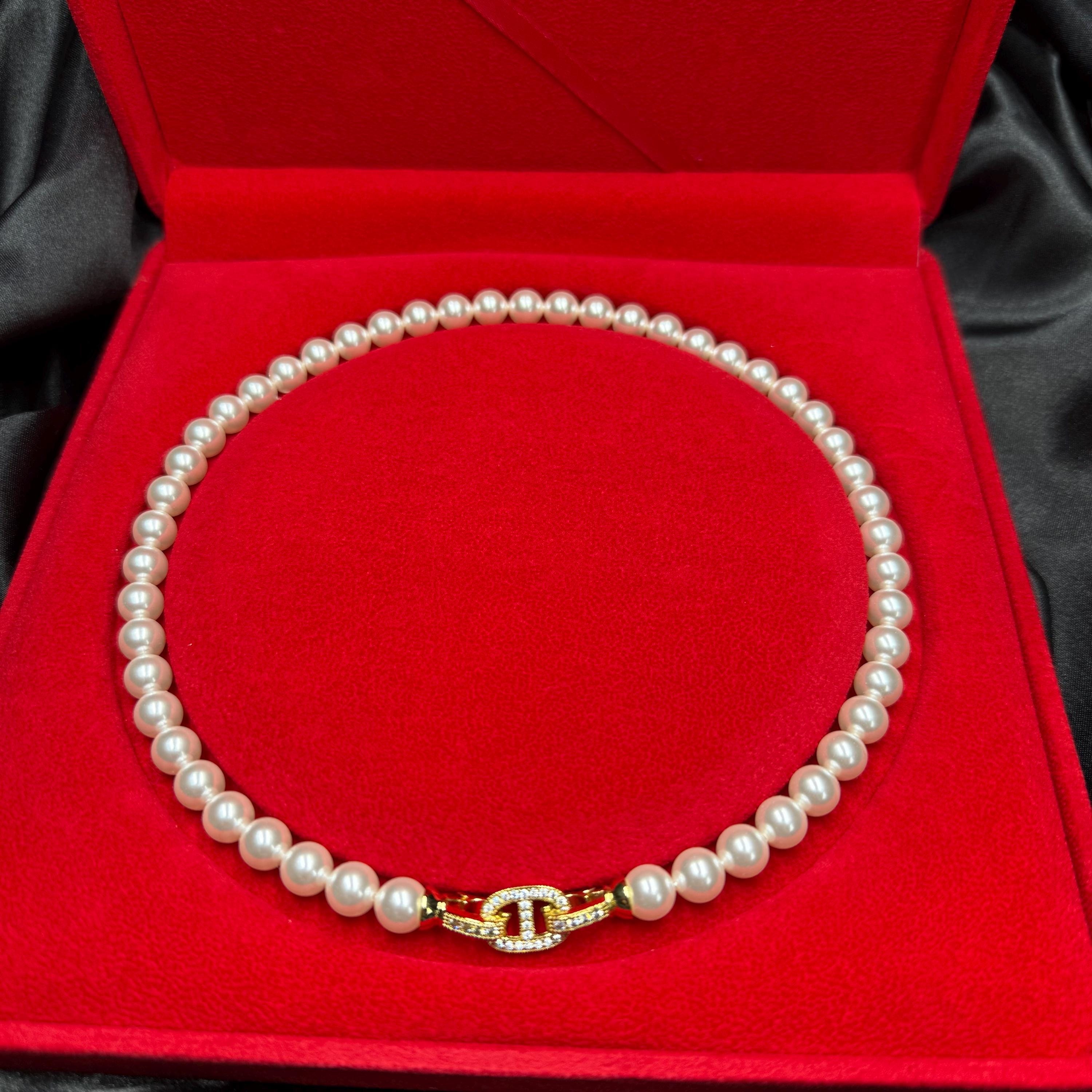 Swarovski pearl necklace Romantic Gift Necklace Crystal Pearl Design Elegant Anniversary Present Wife Birthday Surprise Luxury Jewelry Collection Special Occasion Piece Gold Plated Clasp Crystal Accent Details Eight MM Pearls Seventeen Inch Length Formal Event